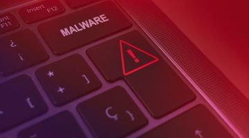 Teil einer Tastatur eines Laptops mit der Aufschrift MALWARE